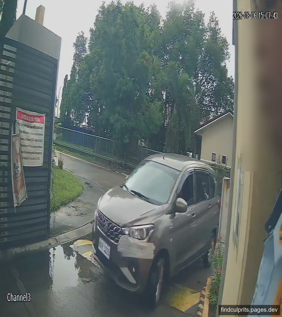 The same vehicle seen front-on in the rain, where the colour looks much lighter